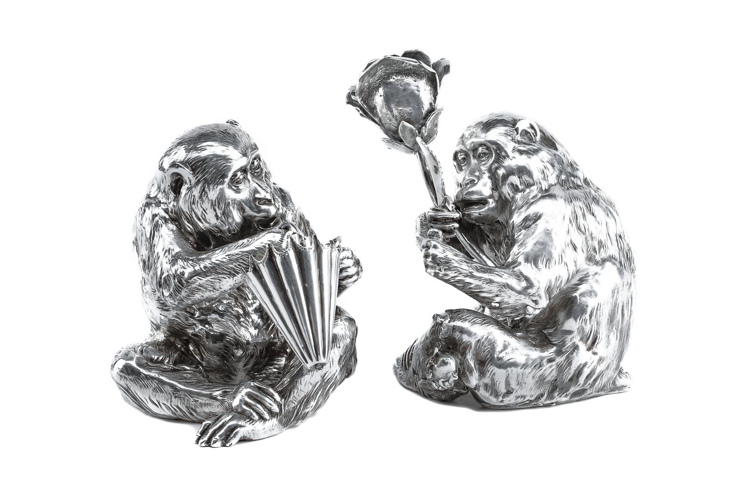 A Pair of Italian Silver-Plate Monkey Figures, Mid-20th Century, each in the form of a seated monkey, one figure holding an umbrella an