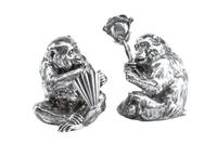 A Pair of Italian Silver-Plate Monkey Figures, Mid-20th Century, each in the form of a seated monkey, one figure holding an umbrella an