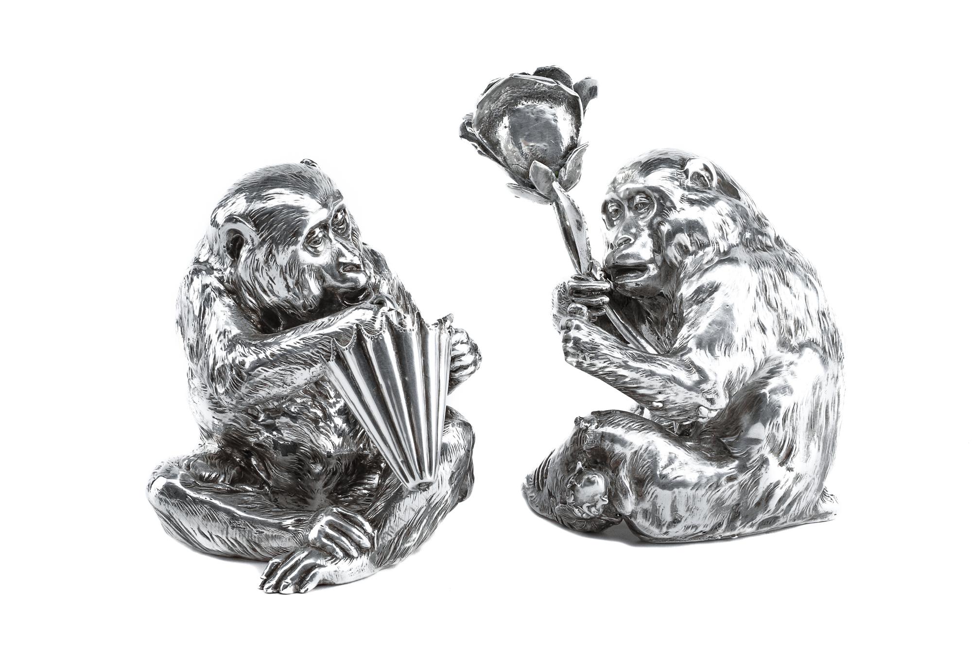 A Pair of Italian Silver-Plate Monkey Figures, Mid-20th Century, each in the form of a seated monkey, one figure holding an umbrella an
