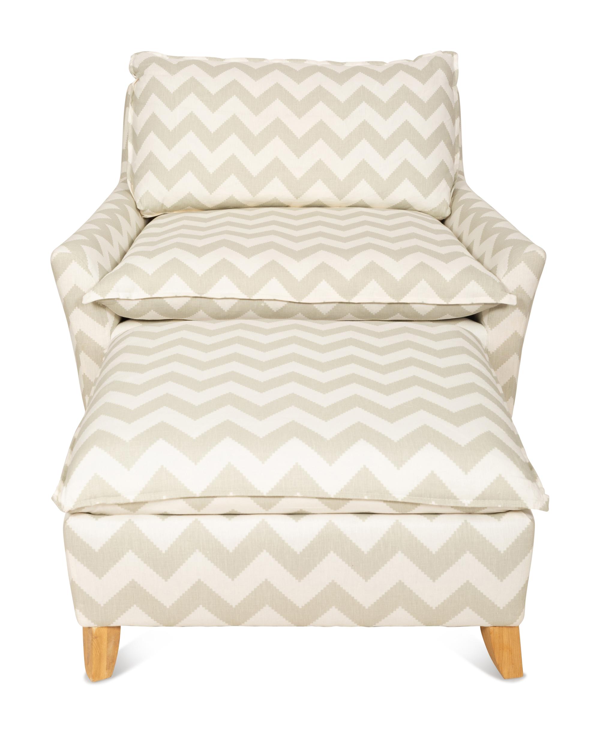 A Contemporary Upholstered Armchair and Ottoman