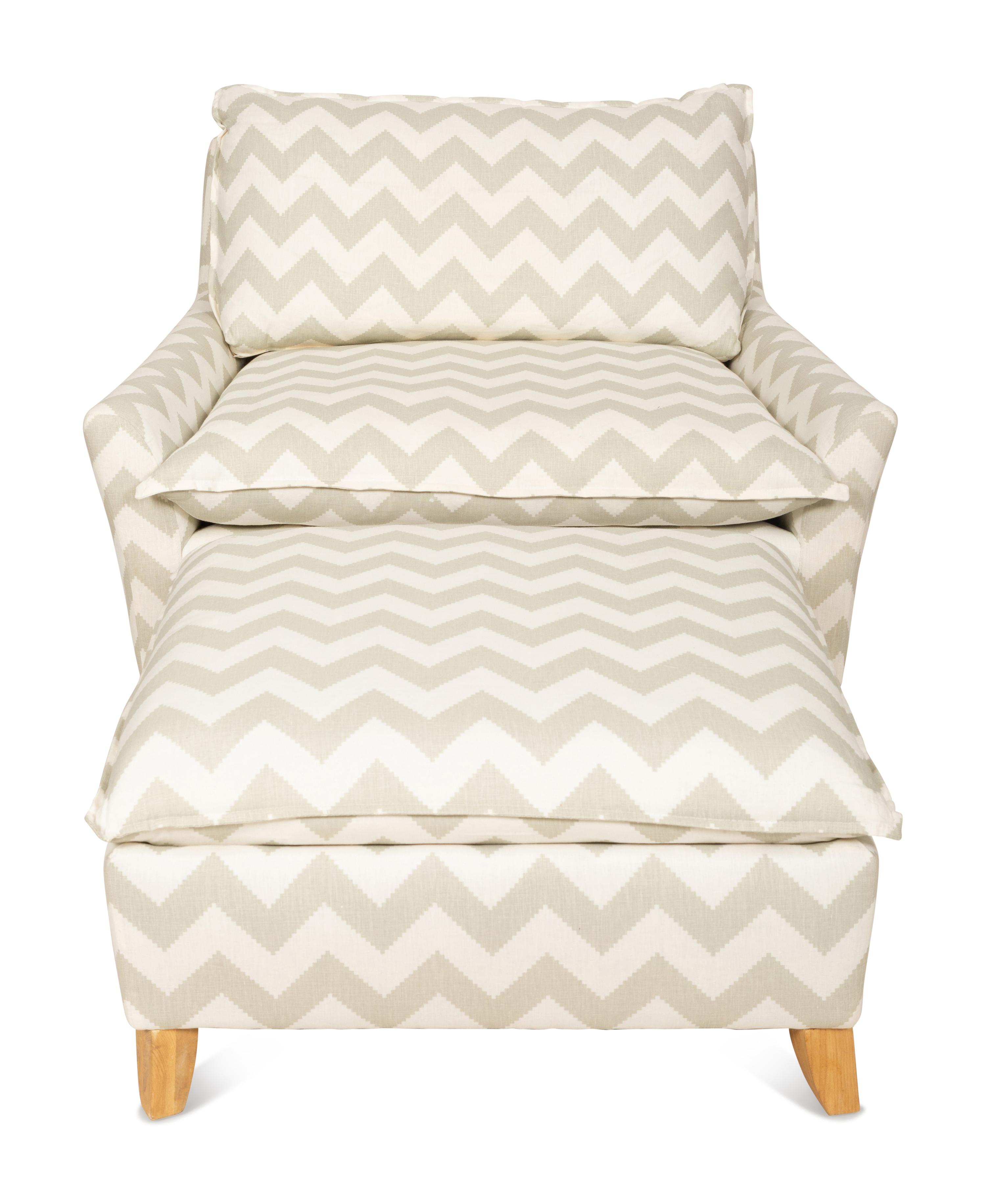 A Contemporary Upholstered Armchair and Ottoman