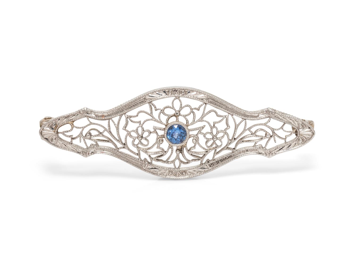 A 14 Karat White Gold and Sapphire Brooch,