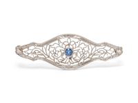 A 14 Karat White Gold and Sapphire Brooch,