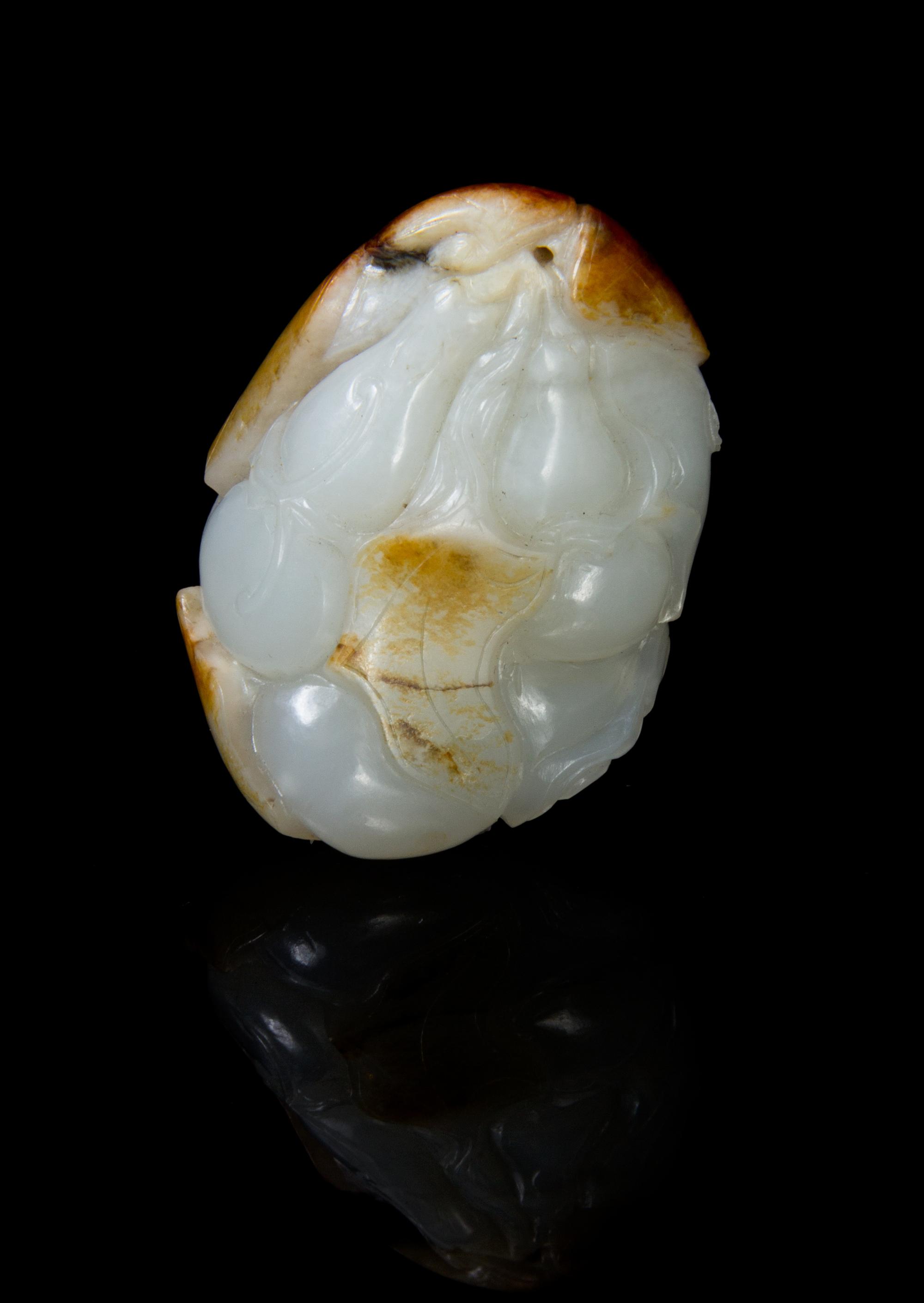 A Carved White Jade Pendant Height 1 7/8 inches.