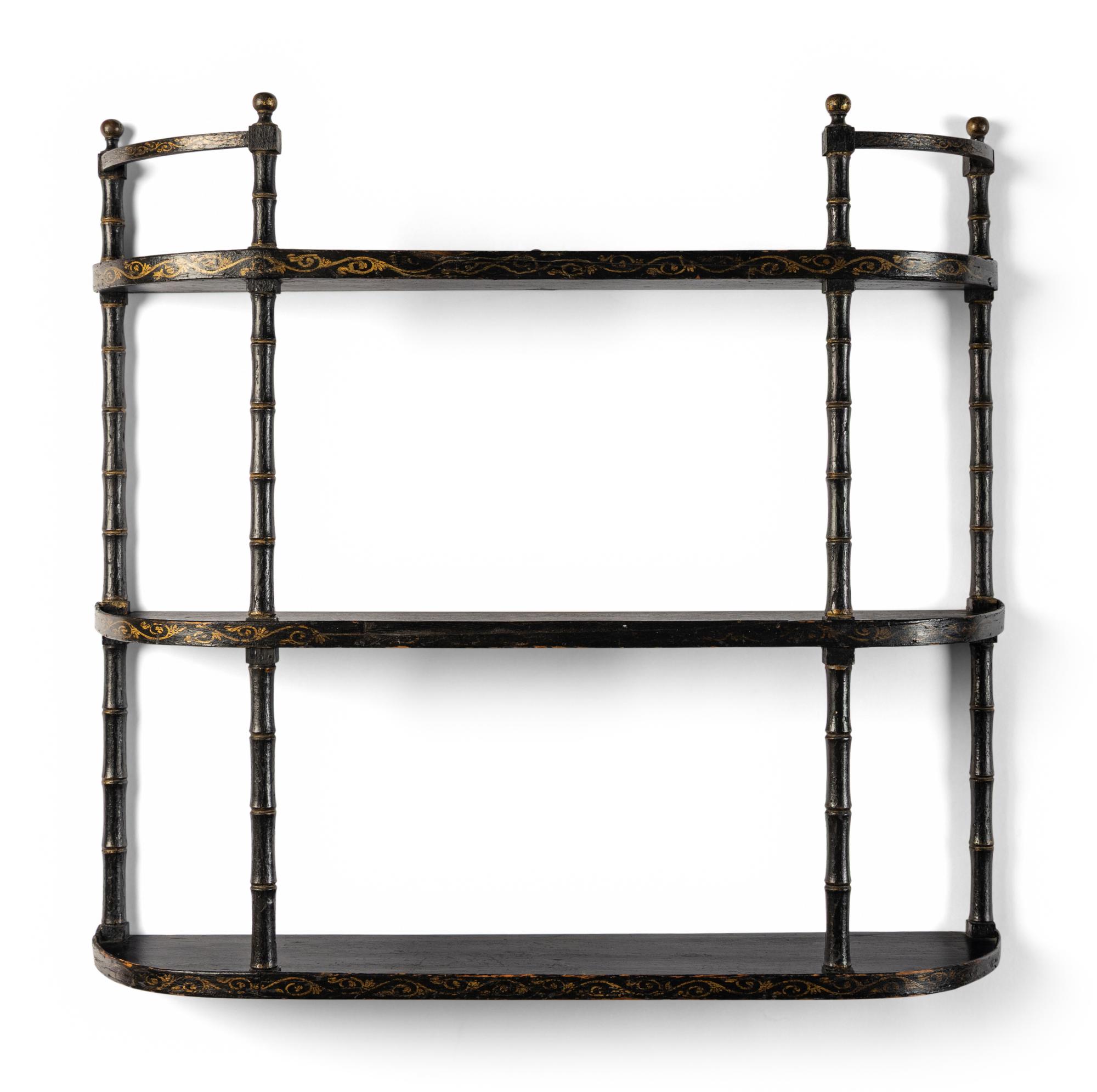 A Victorian Ebonized and Parcel-Gilt Hanging Étagère