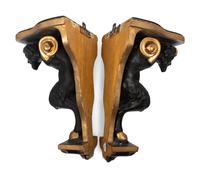 A Pair of Continental Ebonized and Parcel Gilt Wood Figural Brackets