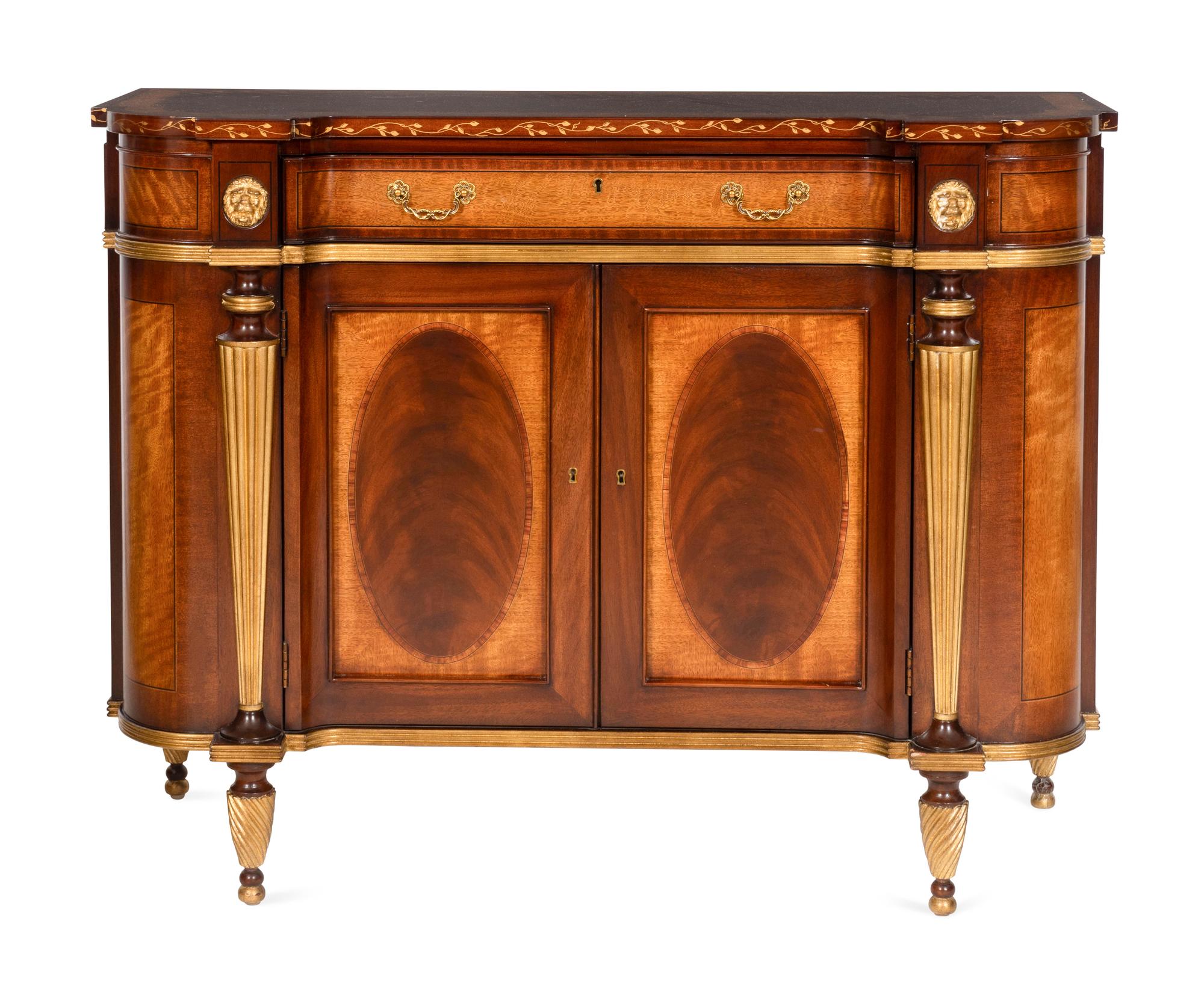A Pair of E.J. Victor Regency Style Parcel Gilt Mahogany Sideboards