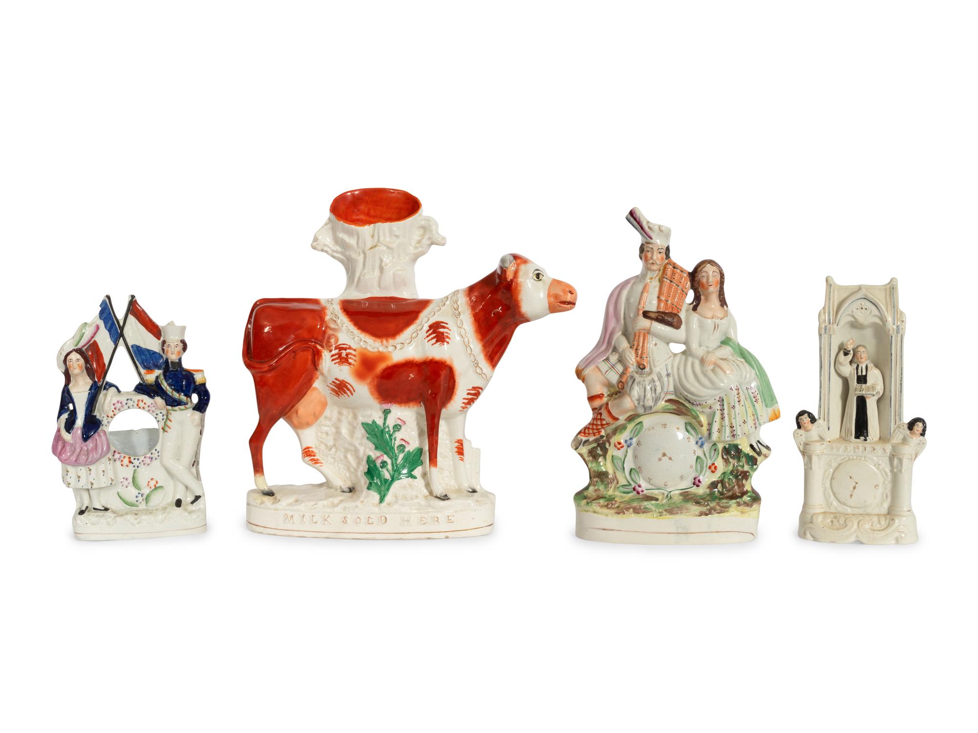 A Collection of Twelve Staffordshire Pottery Figures and Figural Wares