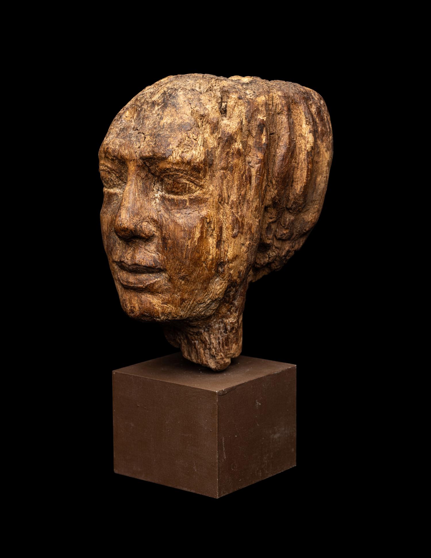 An Egyptian Wood Head of a Priest