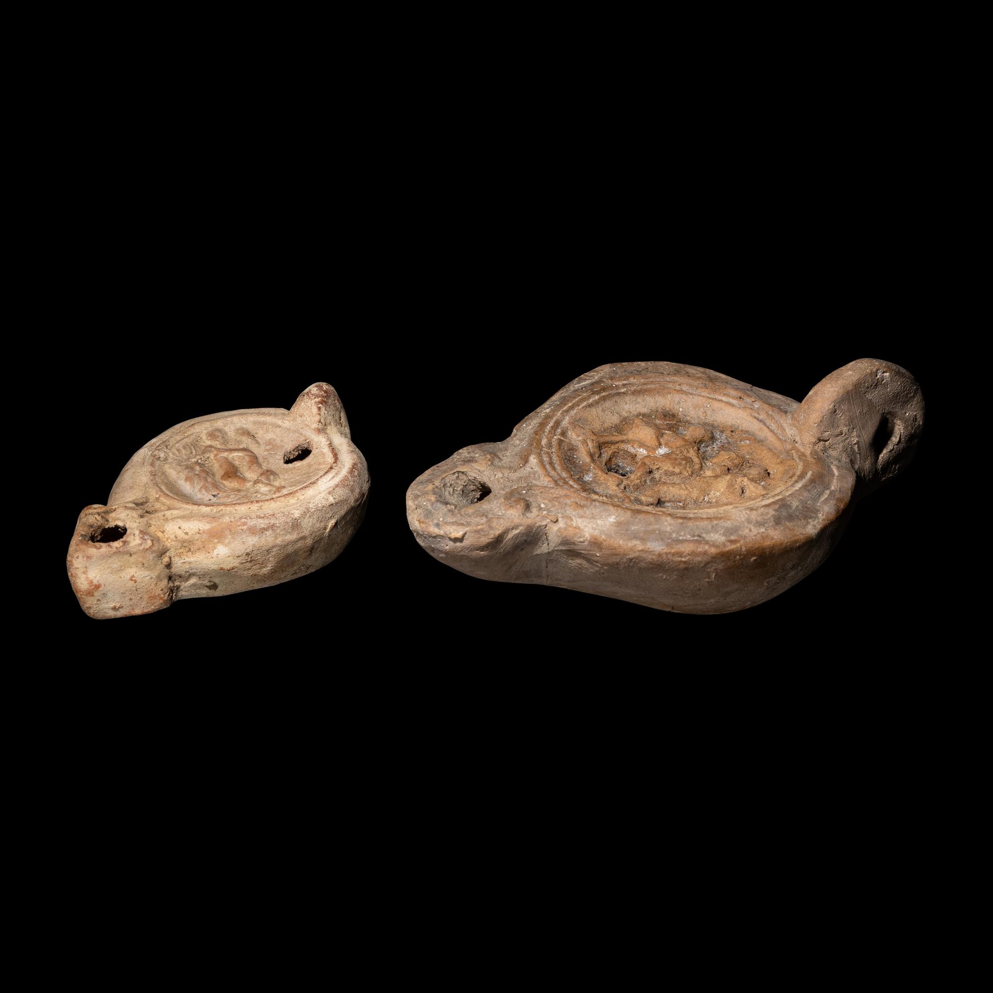 Two Roman Terracotta Lamps with Erotic Scenes