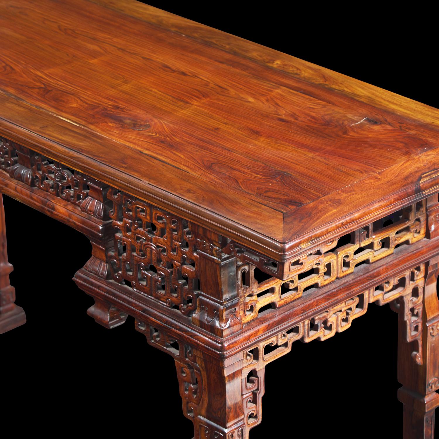 A Chinese Carved Huanghuali Side Table, Tiaozhuo, Late 19th to 20th Century 晚清民國 黃花梨透雕夔龍紋條桌