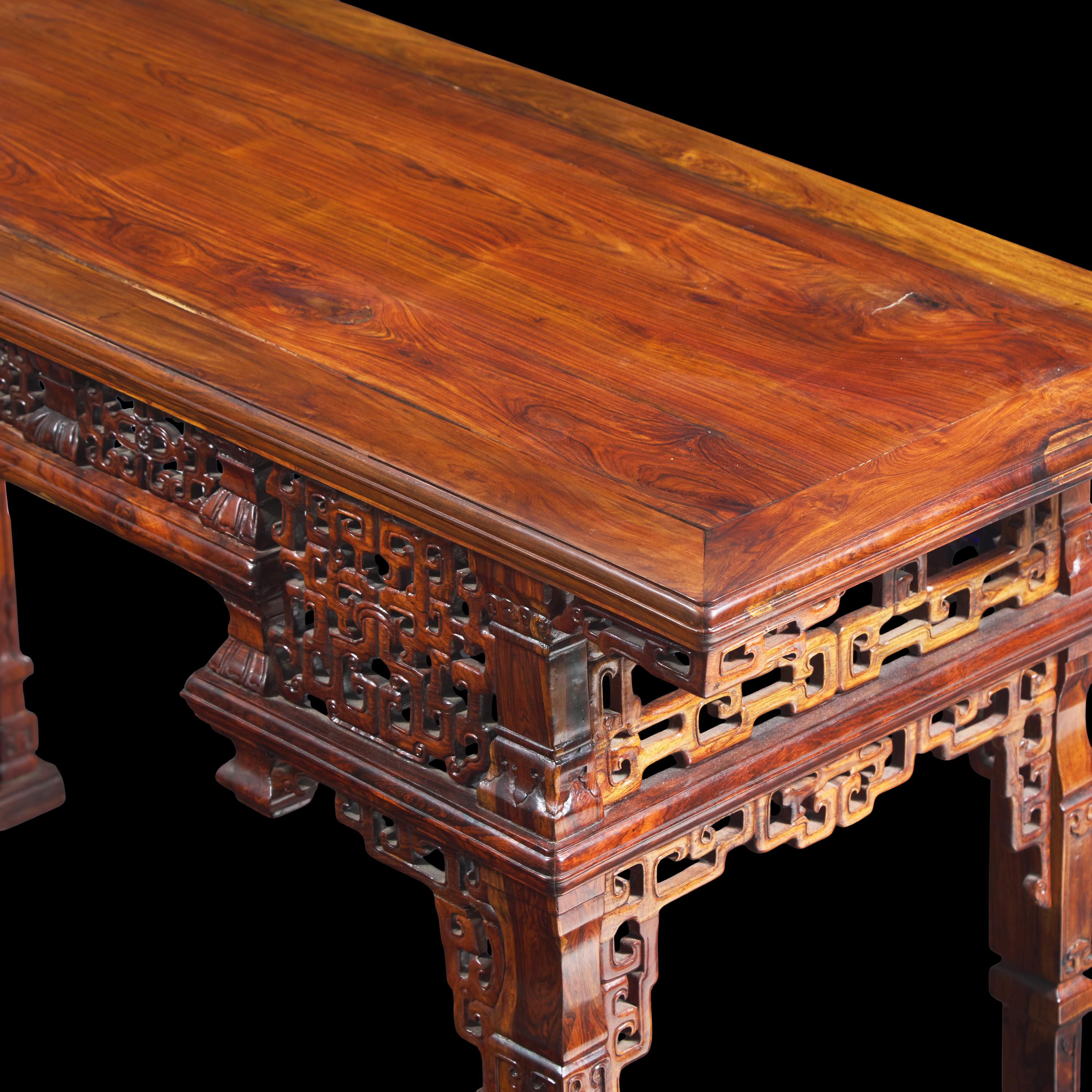 A Chinese Carved Huanghuali Side Table, Tiaozhuo, Late 19th to 20th Century 晚清民國 黃花梨透雕夔龍紋條桌