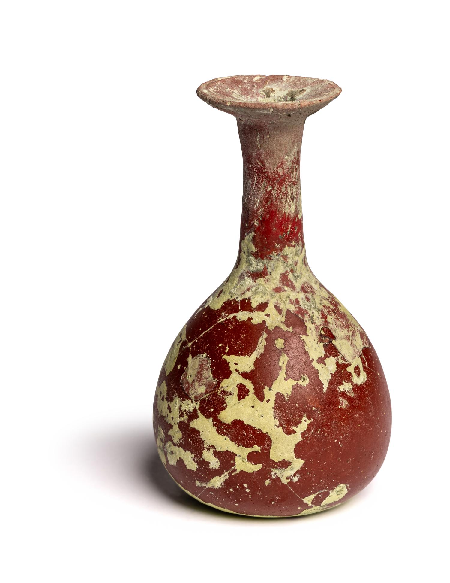 A Hellenistic or Roman Opaque Dark Red Glass Bottle