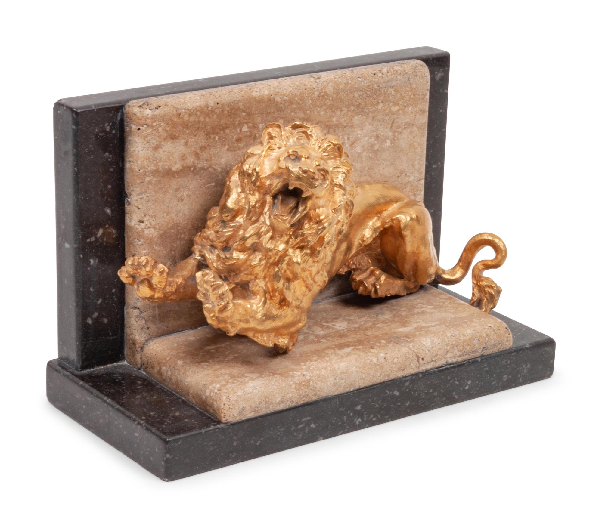 A Gilt Bronze and Limestone Lion Bookend