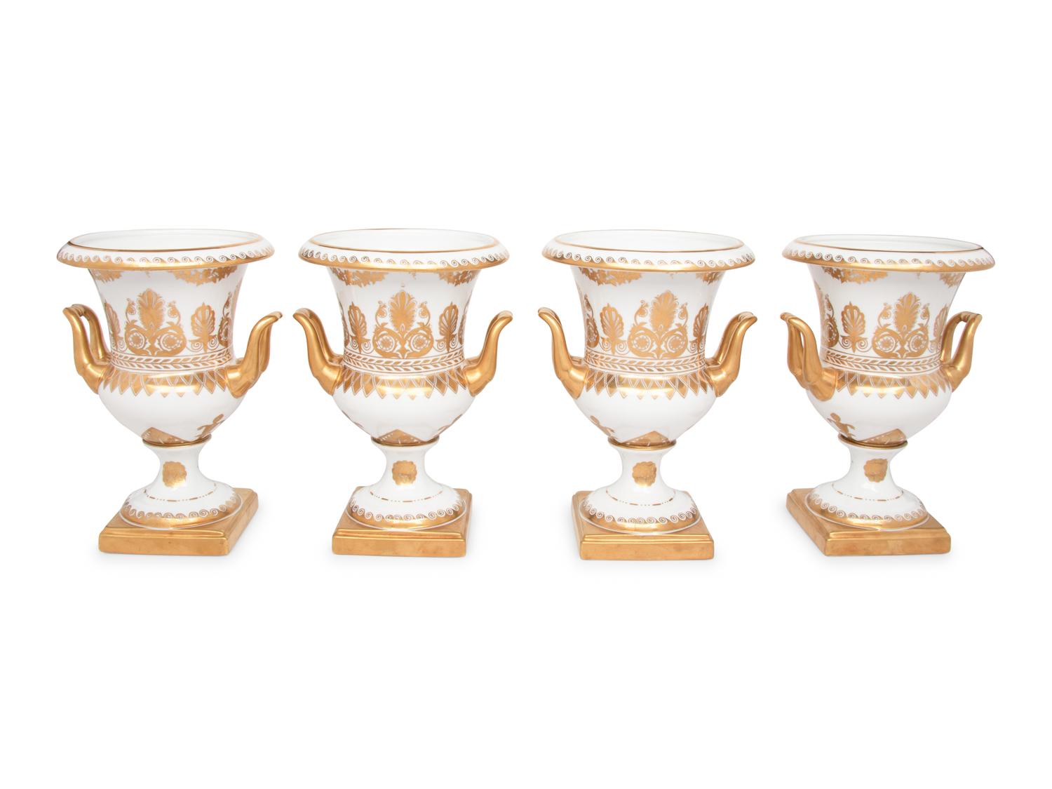 A Set of Four Gilt-Decorated Porcelain Urns