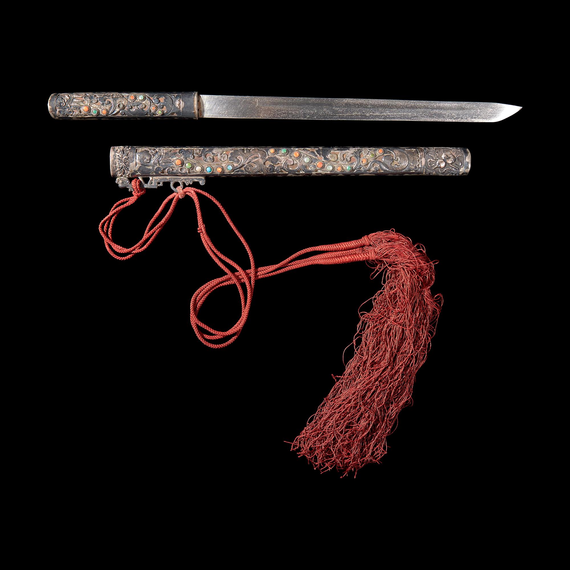 A Sino-Tibetan or Mongolian Embellished Silver Knife and Scabbard 藏漢或蒙古 嵌寶銀匕首一幅