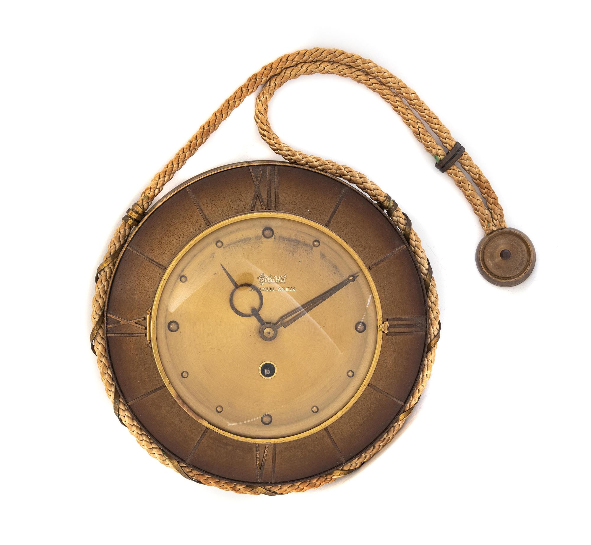 A German Gilt Metal Wall Clock