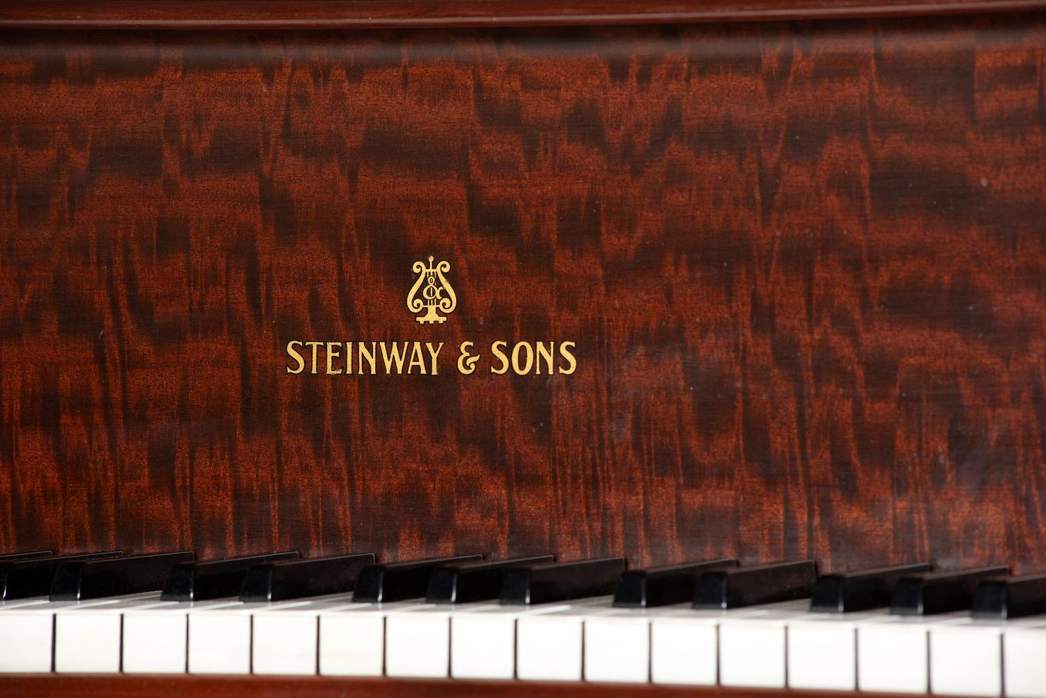 A Steinway and Sons Mahogany Baby Grand Piano