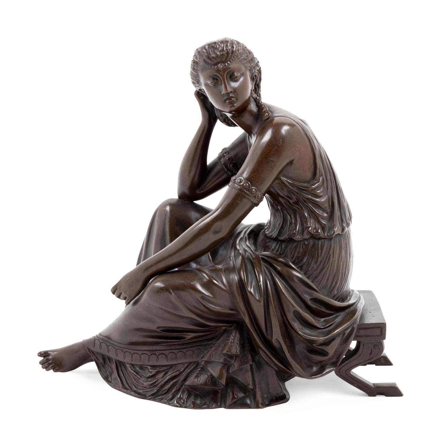 A Continental Patinated Bronze Seated Maiden