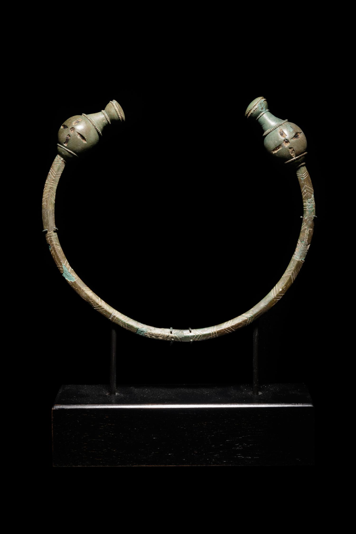 A Celtic Bronze Torc with Poppy-Head Terminals
