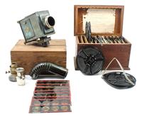 A Brass and Cast Metal Magic Lantern Height of magic lantern 7 1/2 inches.