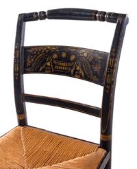 A Set of Four Ebonized and Stenciled Hitchcock Side Chairs
