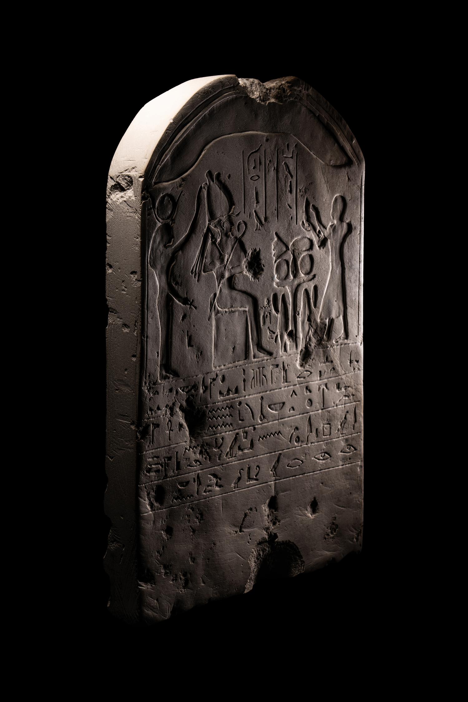 An Egyptian-Style Limestone Round-Topped Stele