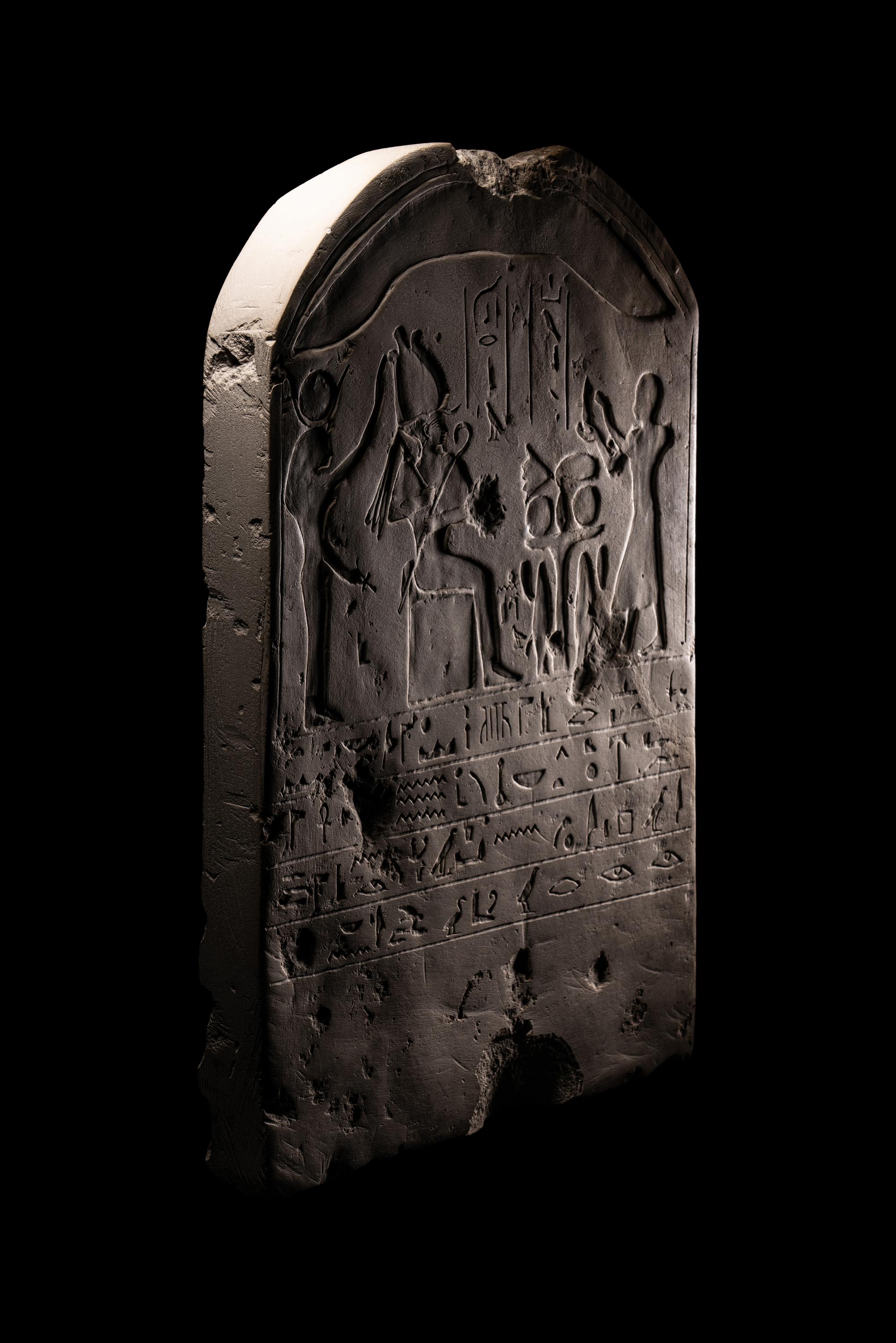 An Egyptian-Style Limestone Round-Topped Stele