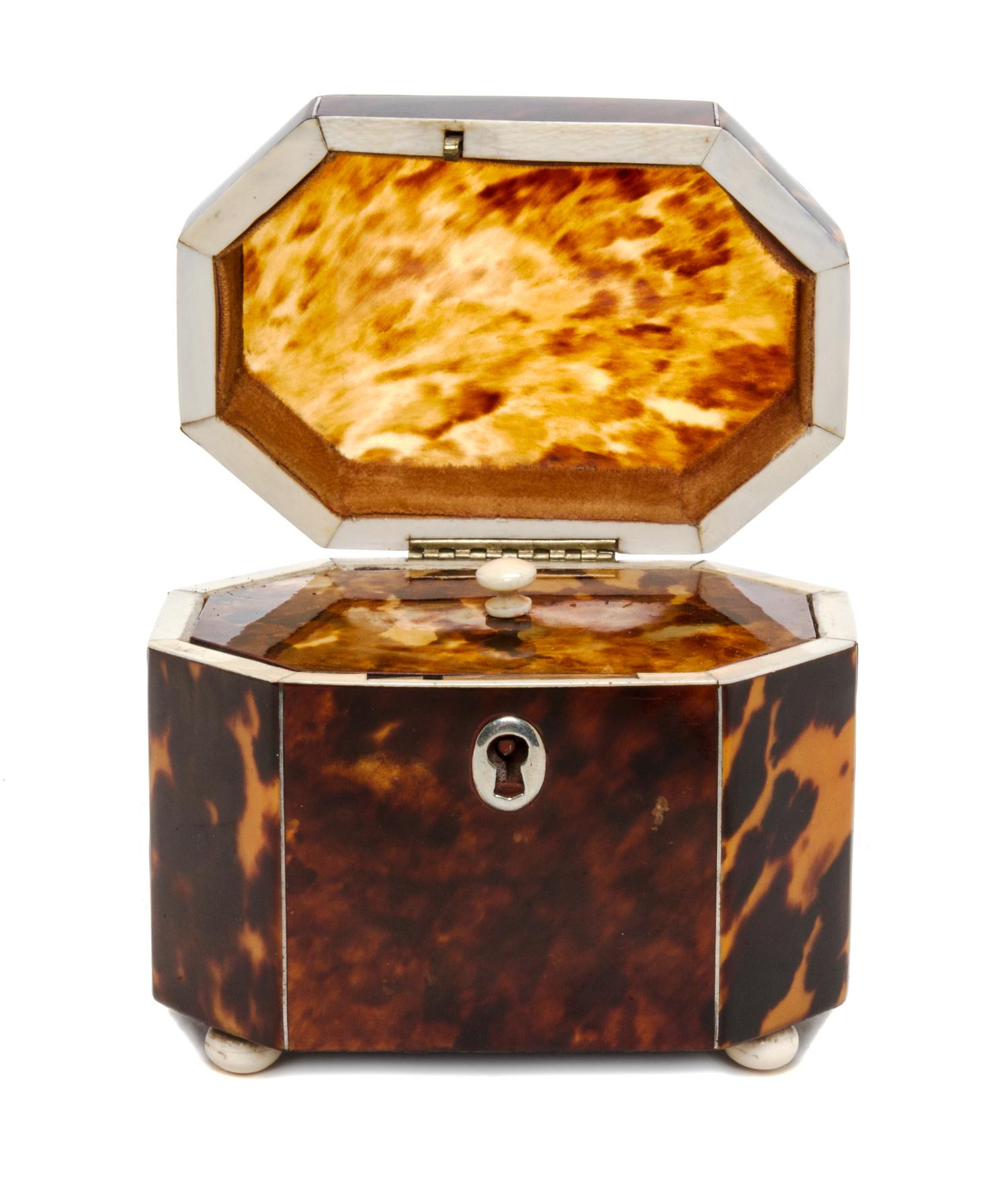 An English Tortoise Shell Tea Caddy, Height 3 1/2 x width 4 x depth 2 3/4 inches.