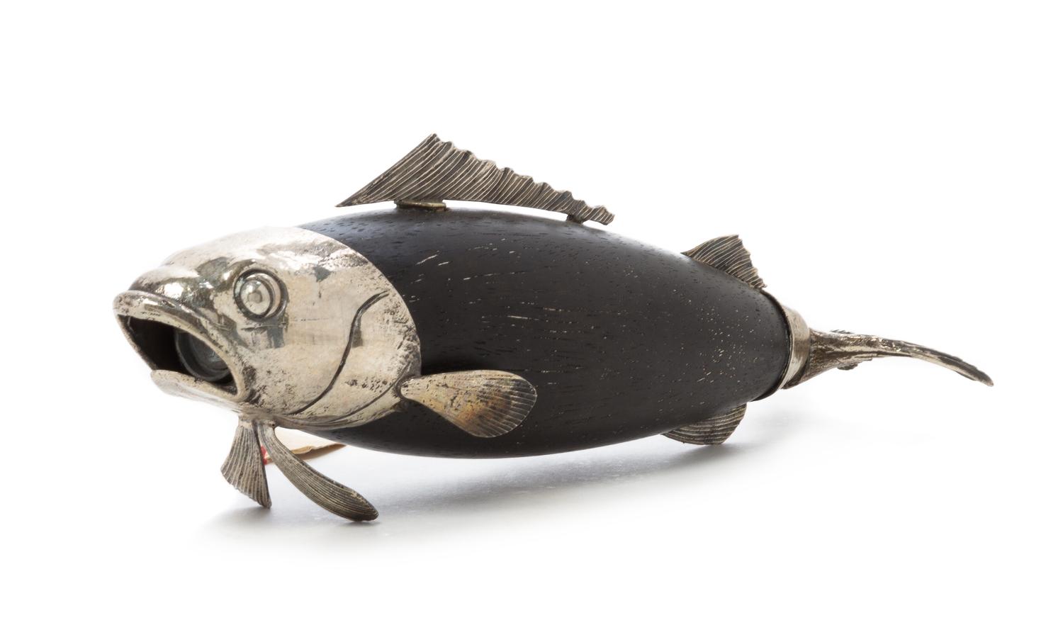 An Italian Silver and Ebonized Wood Pepper Mill, Mid-20th Century, in the form of a fish.