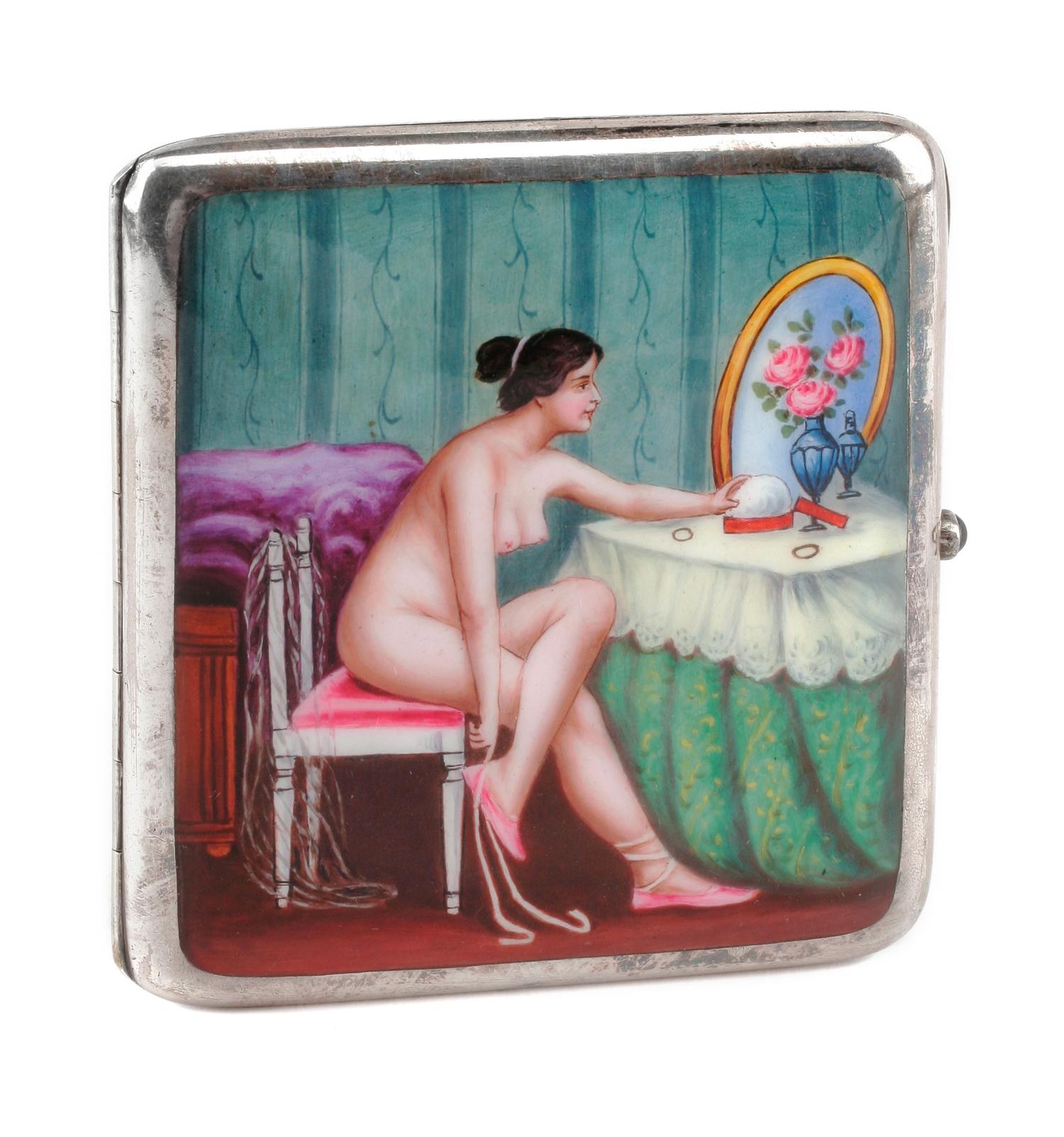 An Enameled Silver Cigarette Case, Late 19th/Early 20th Century, the lid enameled to show a seated nude before a dressing table.