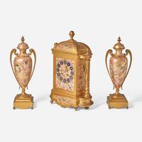 A French three-piece gilt bronze and enamel clock garniture Japy Frères, retailed by Bailey Banks & Biddle, Philadelphia, late 19th century