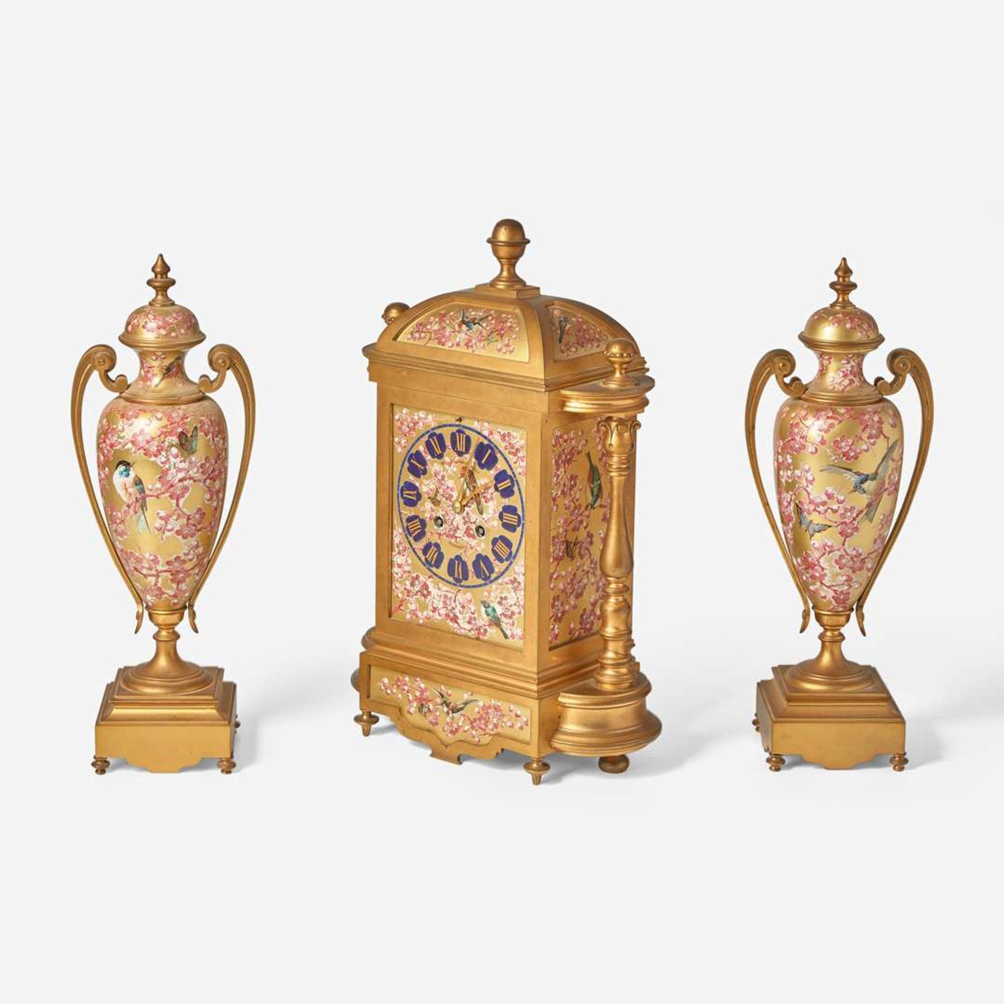A French three-piece gilt bronze and enamel clock garniture Japy Frères, retailed by Bailey Banks & Biddle, Philadelphia, late 19th century