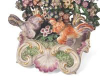 A large collection of seventeen Staffordshire figural groups and floral-form spill vases, late 18th and 19th century