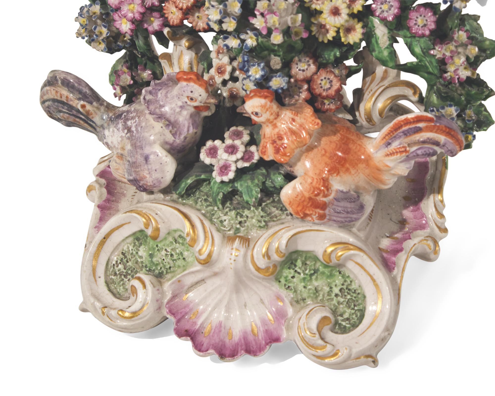 A large collection of seventeen Staffordshire figural groups and floral-form spill vases, late 18th and 19th century