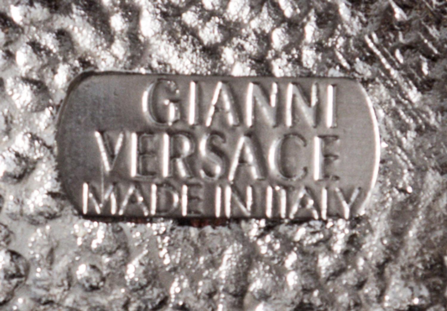A Gianni Versace Screw and Greco Link Belt,