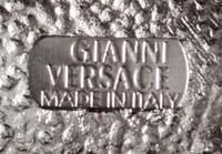 A Gianni Versace Screw and Greco Link Belt,