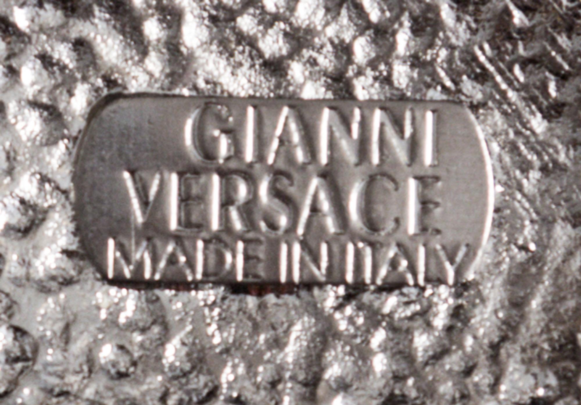 A Gianni Versace Screw and Greco Link Belt,