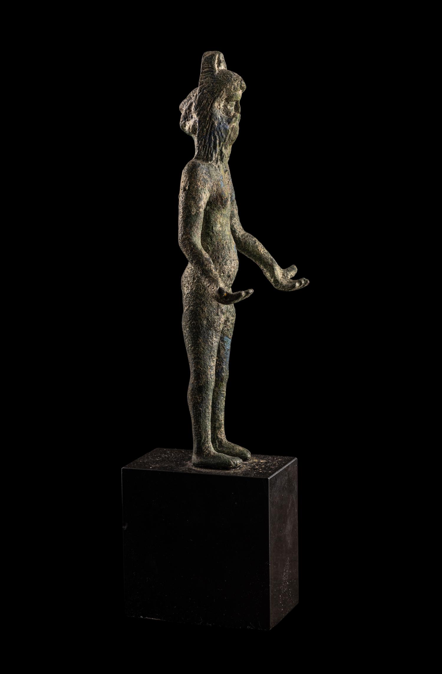 An Etruscan Bronze Female Figure Wearing a Theater Mask