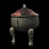 A large Chinese patinated bronze archaistic tripod censer, Ding, and wood cover, The Bronze 17th/18th Century or Earlier 清 青銅鼎式爐
