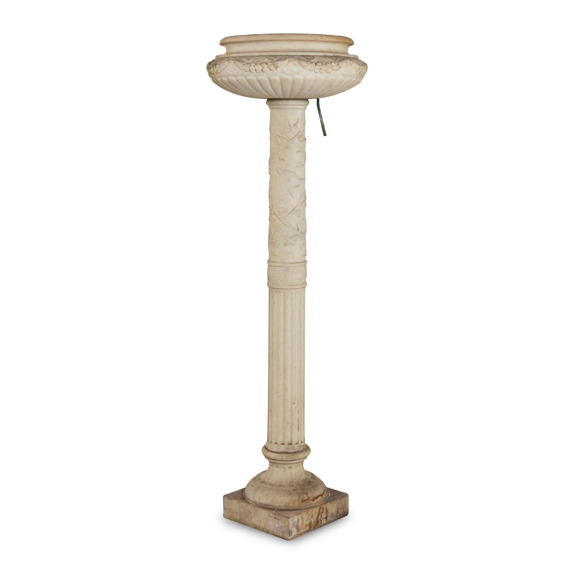 A Pair of Carved Marble Jardinières on Pedestals
