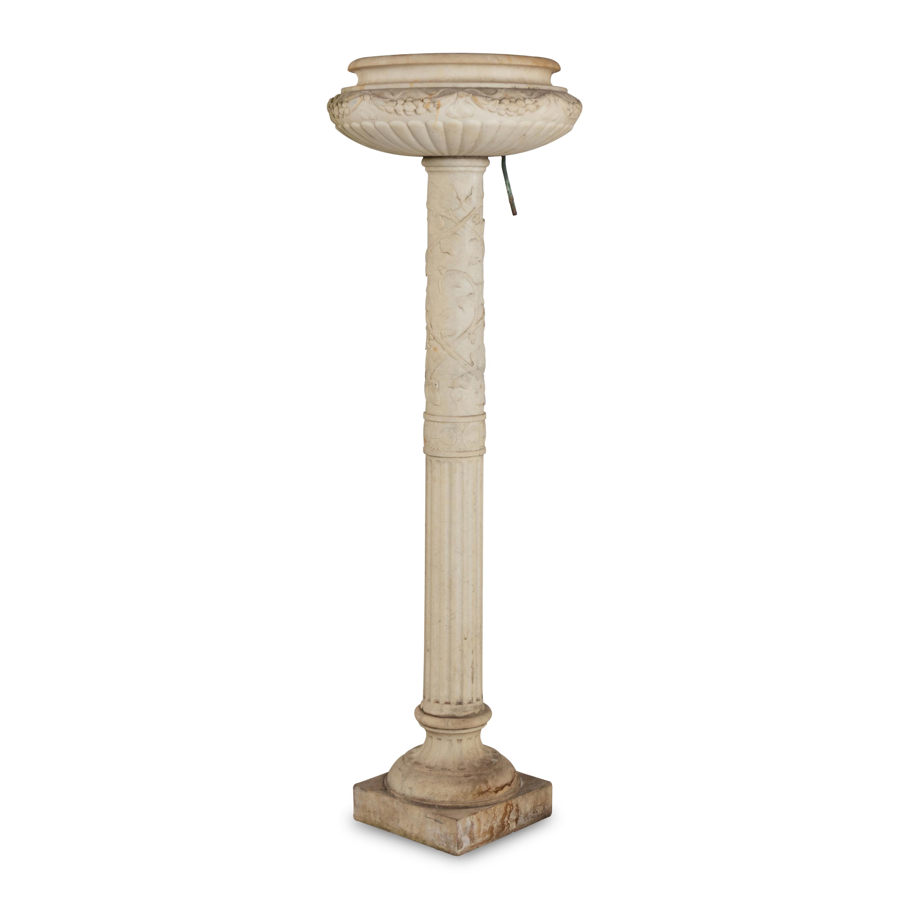 A Pair of Carved Marble Jardinières on Pedestals