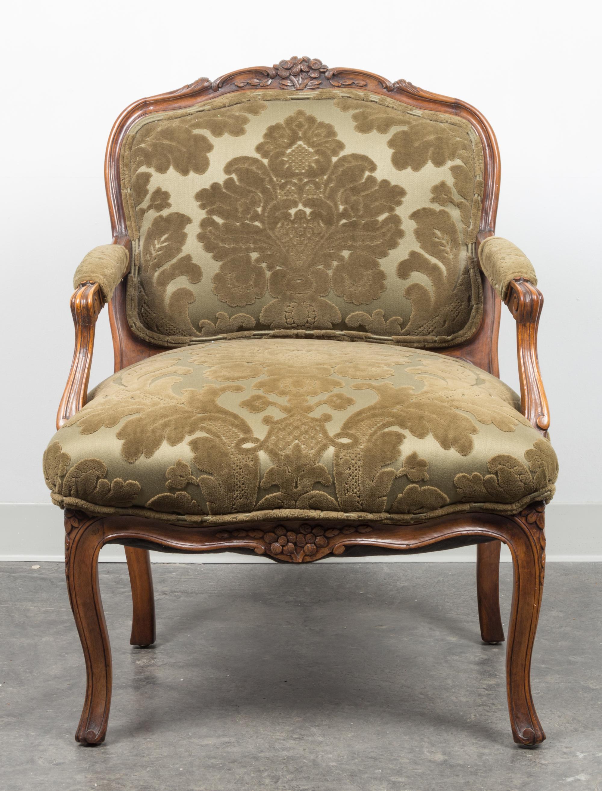 A Louis XV Style Walnut Fauteuil Height 34 x width 22 x depth 20 1/2 inches. — 20TH CENTURY