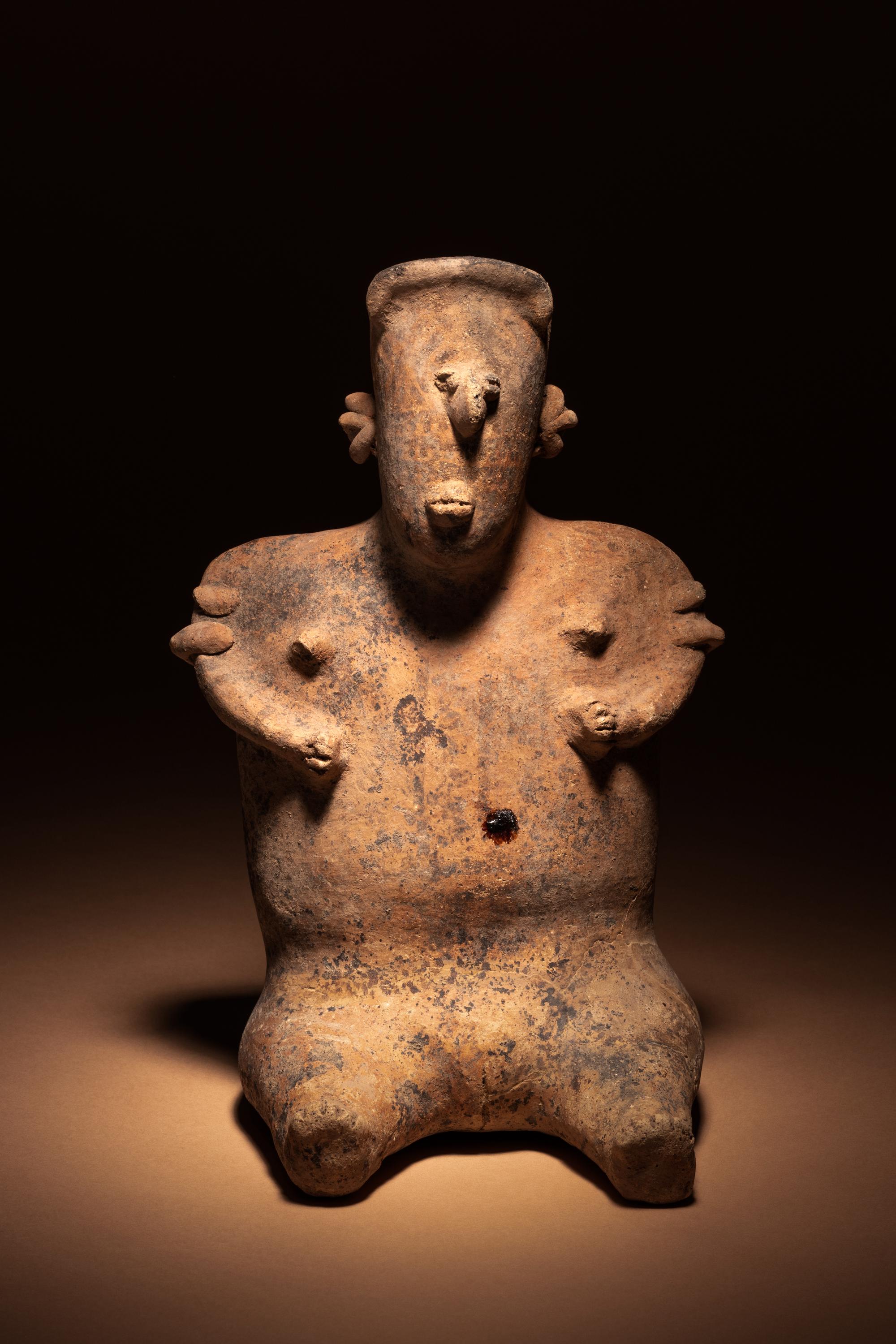 A Nayarit Terracotta Seated Female Figure
