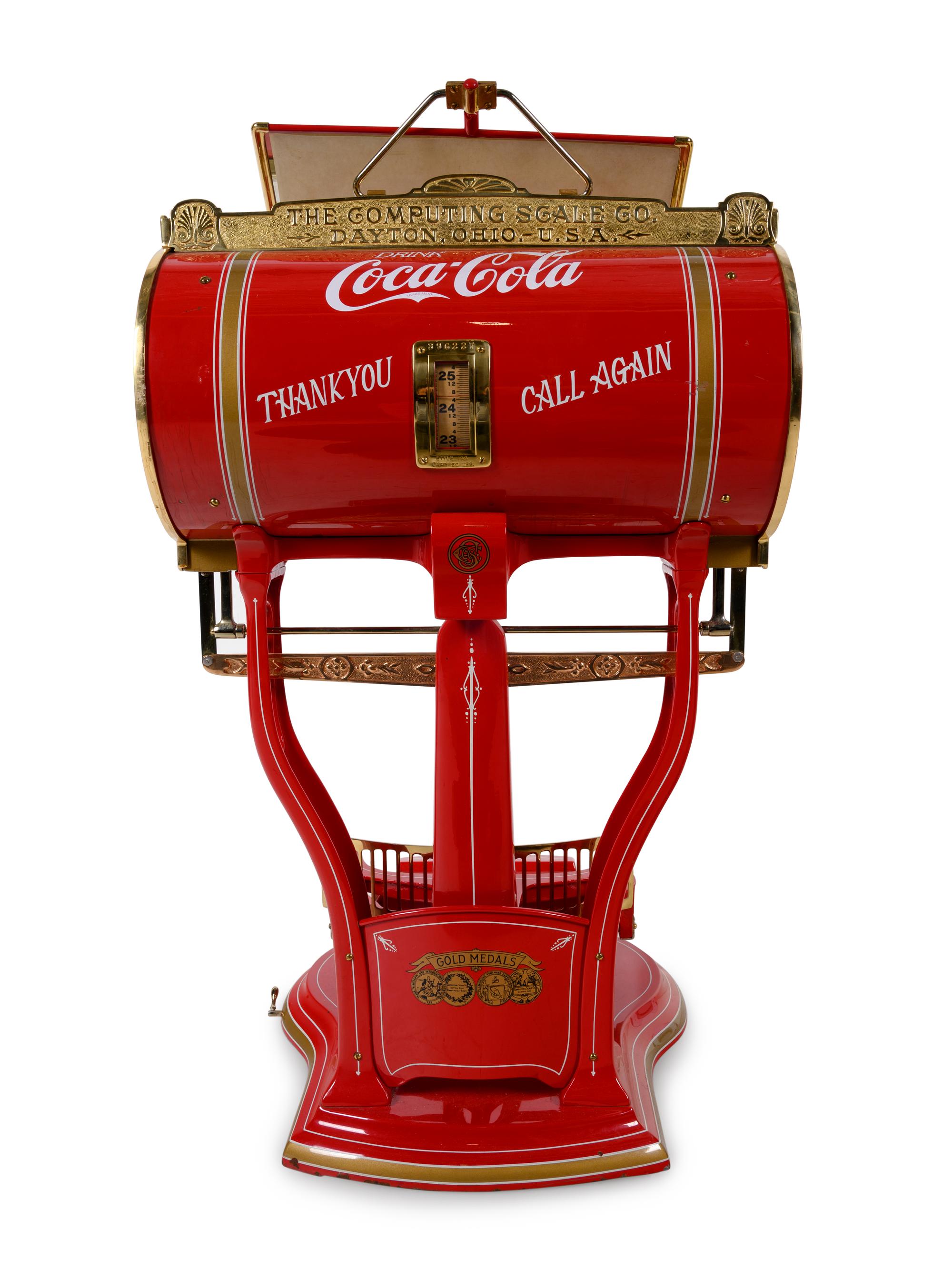 A Red Dayton Computing Scale with Coca-Cola Advertisement