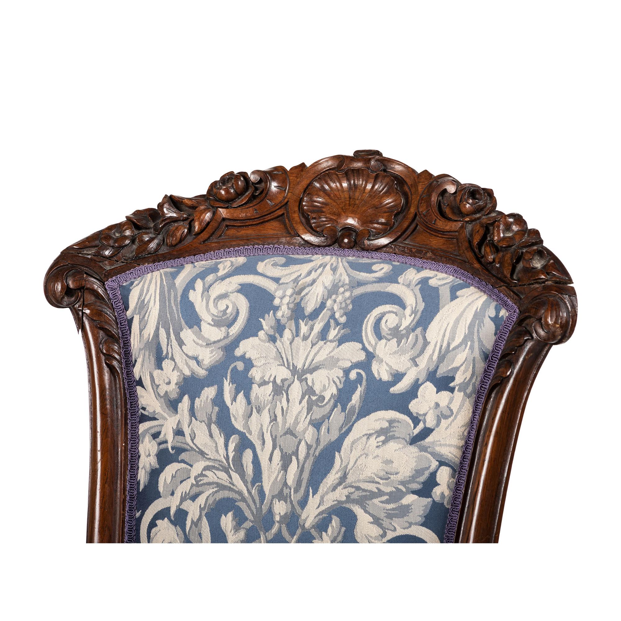 A Pair of Renaissance Revival Carved Walnut Fauteuils