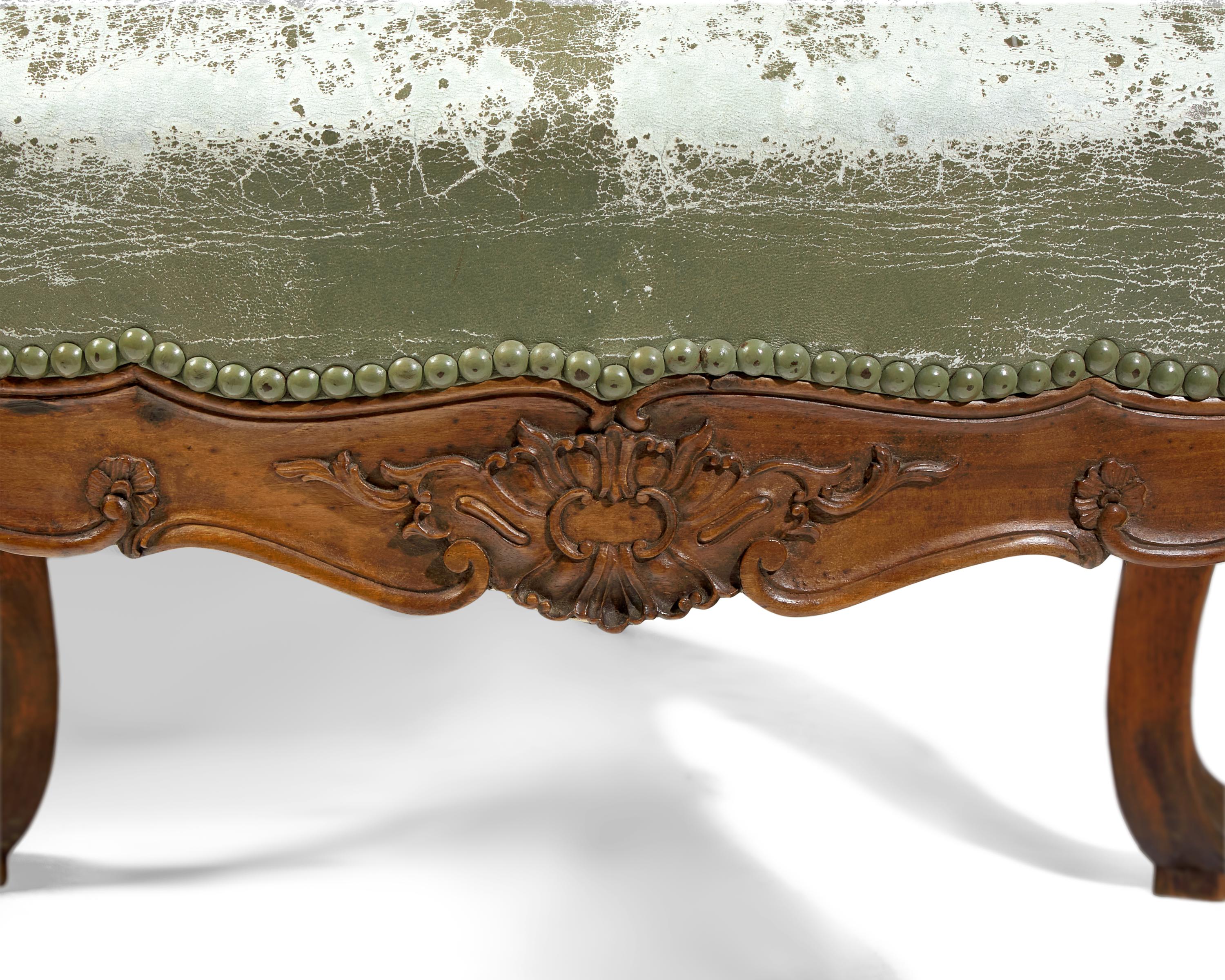 A Pair of Italian Rococo Carved Walnut Armchairs
