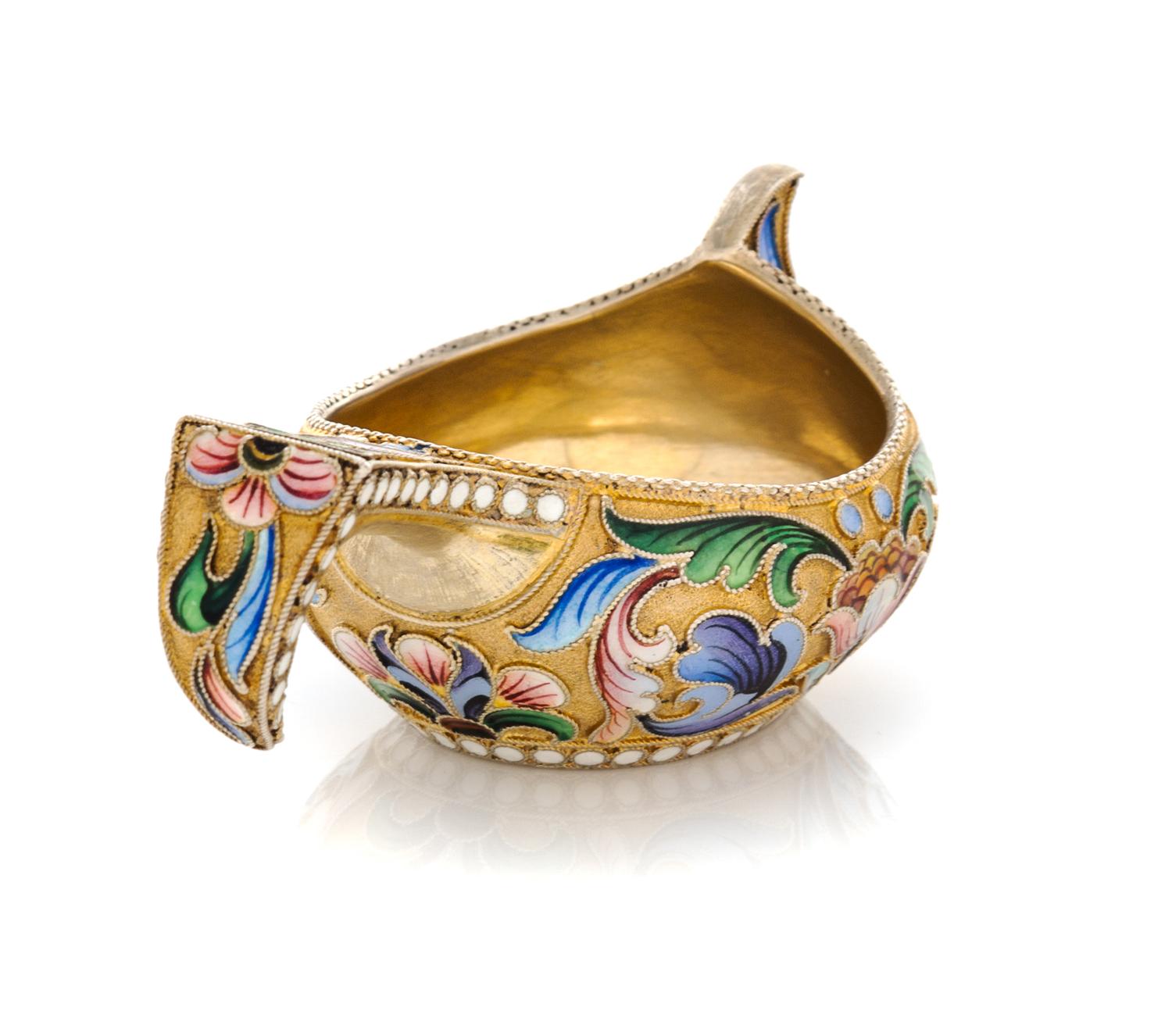 A Russian Silver-Gilt and Enamel Kovsh, Mark of Mikhail Sokolov, Moscow, Late 19th Century, the body and handle decorated with polychro