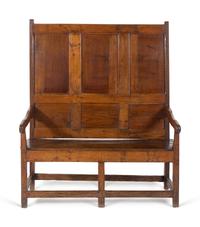 A Jacobean Molded and Paneled Oak Settle