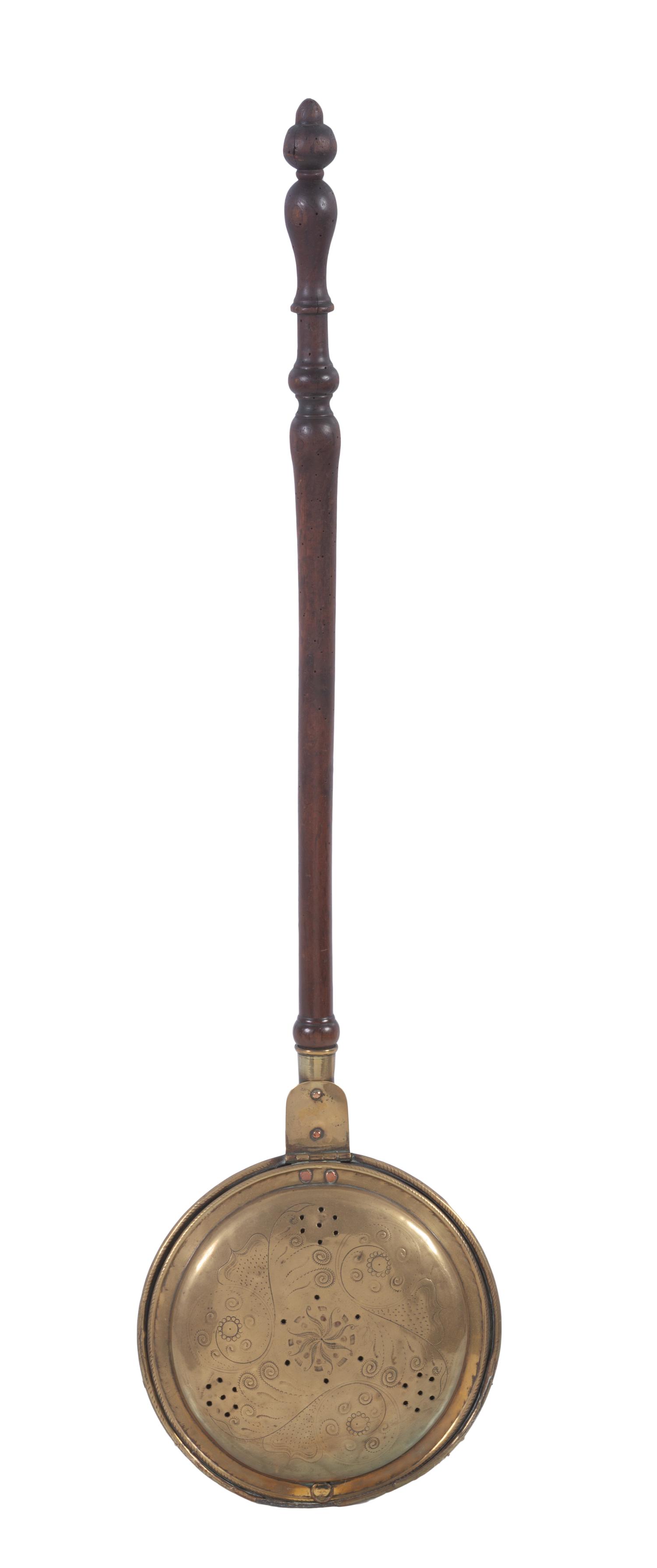 An English Engraved Brass and Turned Walnut Bed Warmer